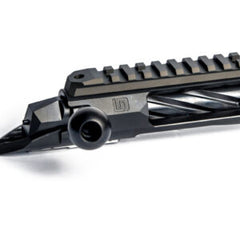 Close-up of the Deadline 2.0 Action showing its black barrel nut prefit design, bolt handle, and precision-machined details for custom barreled action setups.