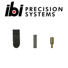 Small metal components including a black latch, a steel spring, and a brass pin arranged below the IBI Precision Systems logo for the HMB Extractor Kit.